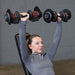  Person performing an incline bench press with Body-Solid Tools SDBX132 Adjustable Dumbbells on an incline weight bench.