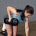 Person performing a single-arm bent-over row with a Body-Solid Tools SDBX132 Adjustable Dumbbell, supporting with the opposite hand on a bench.